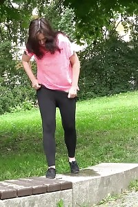 Black Haired Stunner Squatting To Piss Outdoor