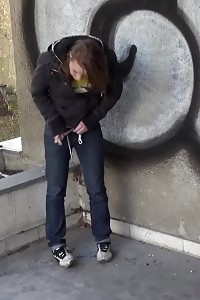 Delightful Babe In Denims Pisses Onto The Concrete