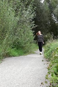 Attractive European Squatting To Piss On A Path
