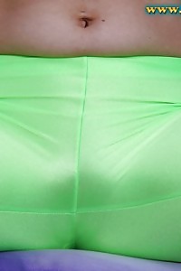 Natalie Poses On The Yoga Ball In Her Green Outfit