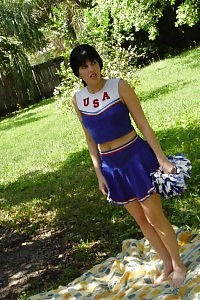 Take A Look At This Excited Cheerleader As She Undressed In The Public And Rubs Her Clit In This Porn
